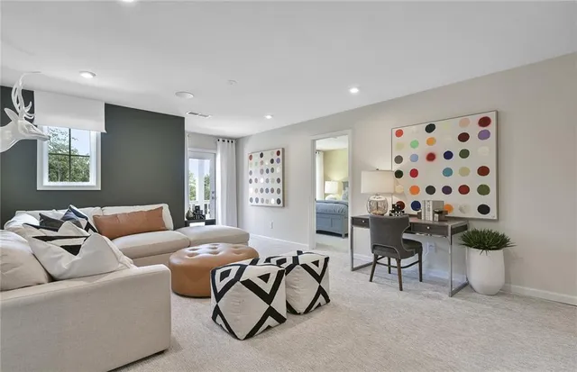 a living room with furniture and a large window