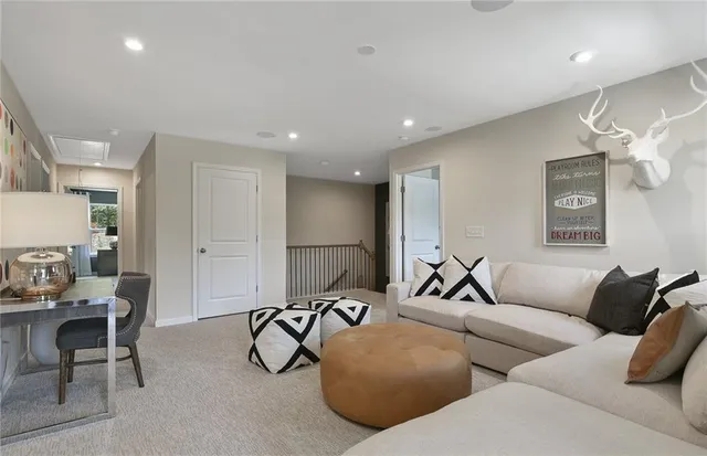 a bedroom with a bed and large mirror