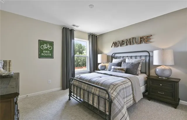 a bedroom with bed and window