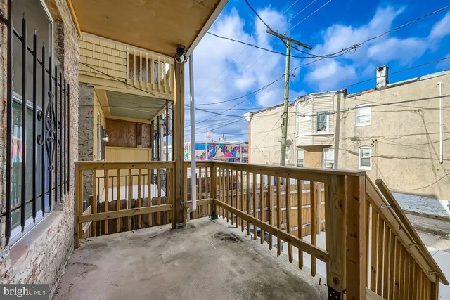 a view of a balcony with a potted plant
