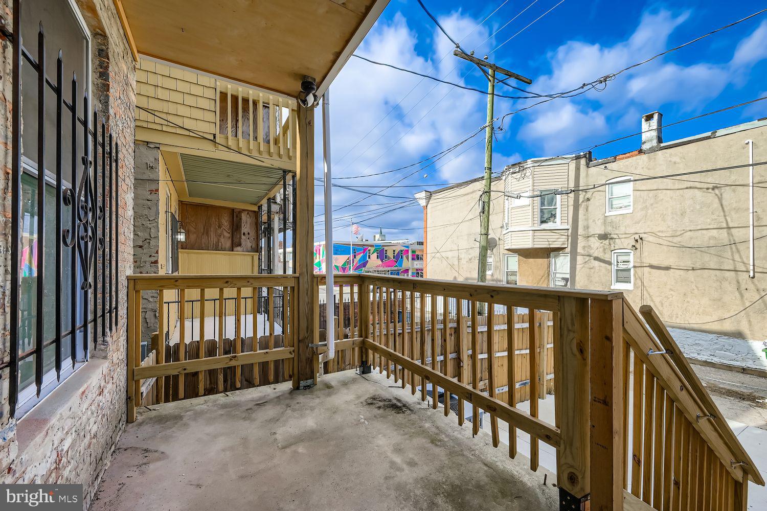 1006 East 20th Street Baltimore, MD 21218 - Photo 11 of 29 a view of a balcony with a potted plant