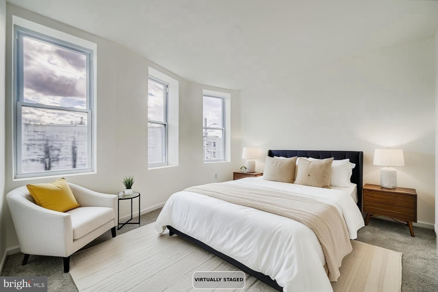 1006 East 20th Street Baltimore, MD 21218 - Photo 12 of 29 a bedroom with a bed and couch