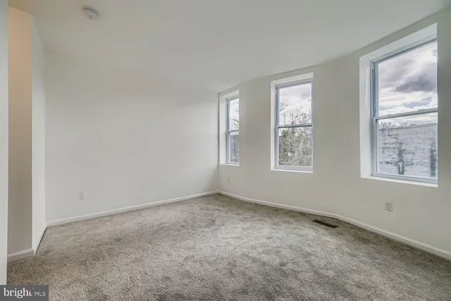 an empty room with windows