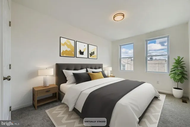 a bedroom with a bed and a couch