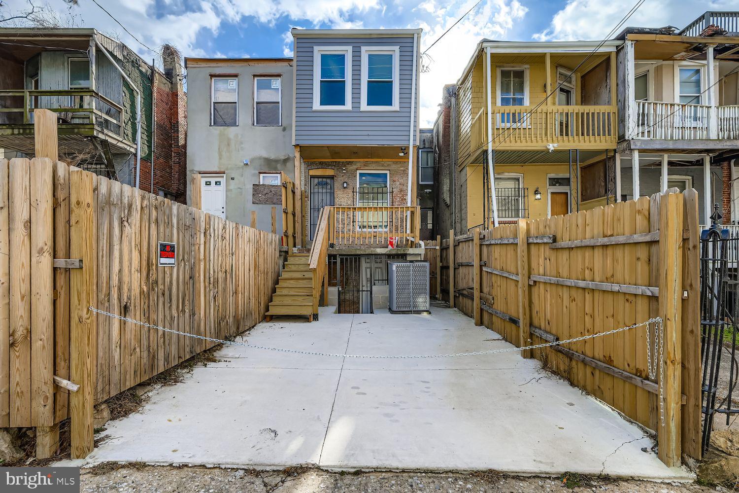 1006 East 20th Street Baltimore, MD 21218 - Photo 25 of 29 a view of a brick house with many windows
