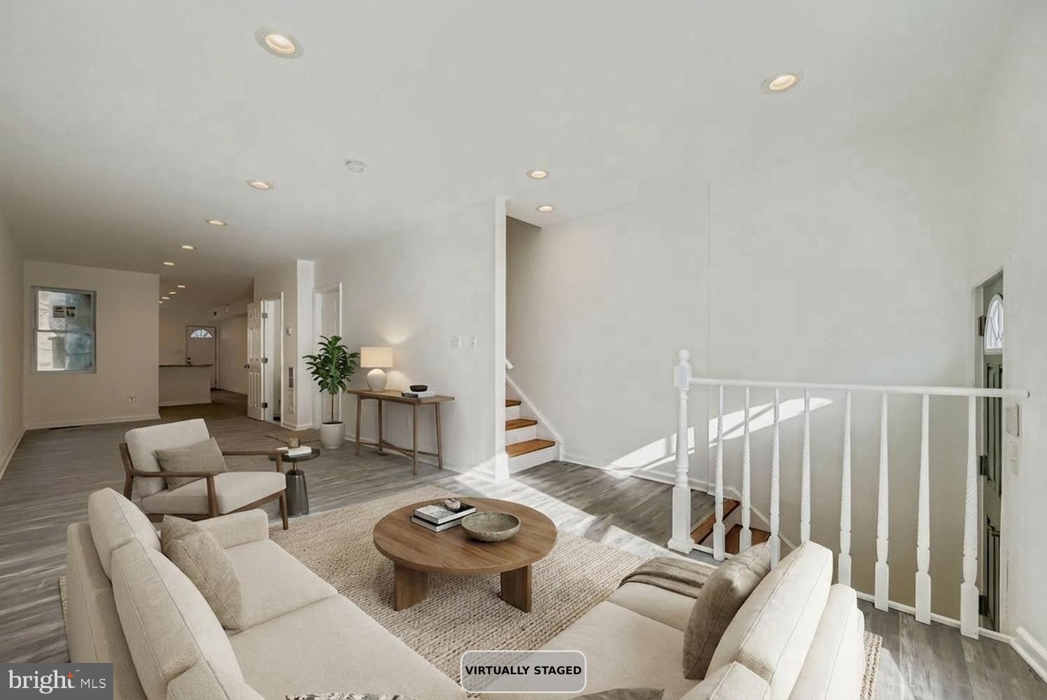 1006 East 20th Street Baltimore, MD 21218 - Photo 3 of 29 a living room with furniture and a wooden floor