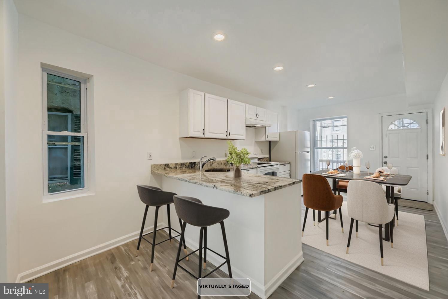 1006 East 20th Street Baltimore, MD 21218 - Photo 8 of 29 a view of a dining room with furniture