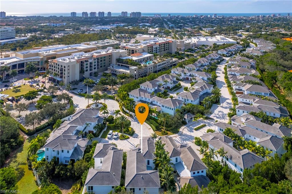 9149 Mercato Way Naples, FL 34108 - Photo 1 of 47 an aerial view of residential houses with outdoor space