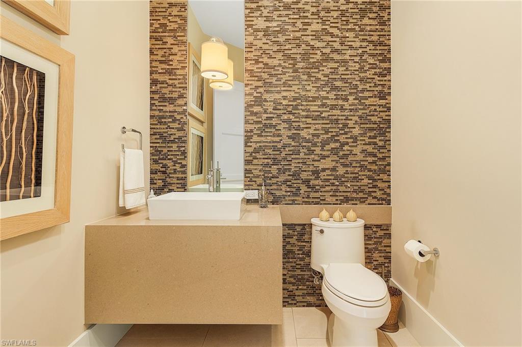 9149 Mercato Way Naples, FL 34108 - Photo 12 of 47 a bathroom with a toilet and a sink