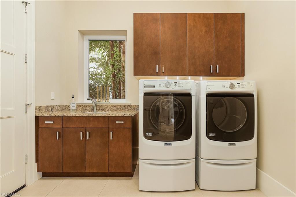 9149 Mercato Way Naples, FL 34108 - Photo 13 of 47 a utility room with dryer and washer
