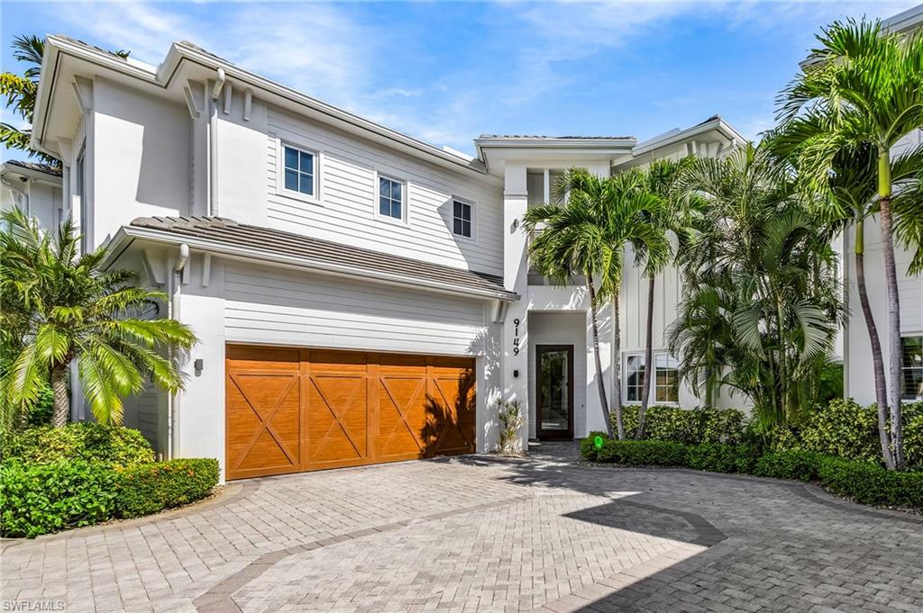 9149 Mercato Way Naples, FL 34108 - Photo 2 of 47 a front view of house with yard