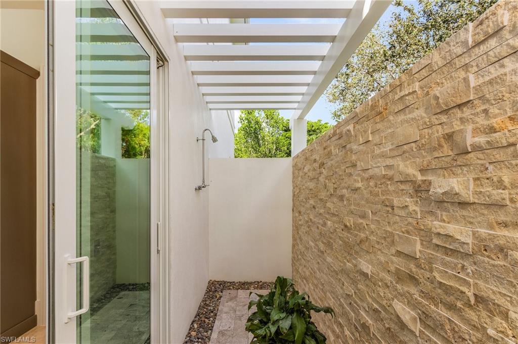 9149 Mercato Way Naples, FL 34108 - Photo 26 of 47 a bathroom with a shower
