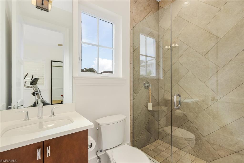 9149 Mercato Way Naples, FL 34108 - Photo 33 of 47 a bathroom with a sink toilet and shower