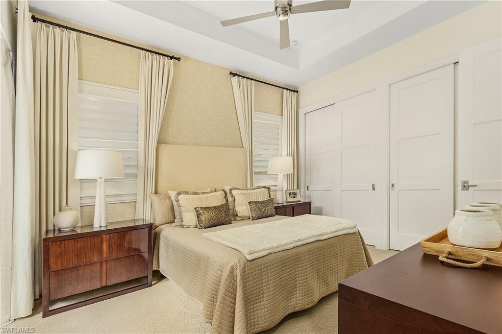 9149 Mercato Way Naples, FL 34108 - Photo 34 of 47 a bedroom with a bed and a window