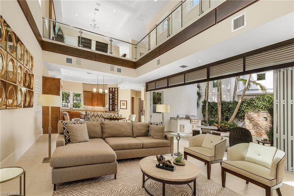 9149 Mercato Way Naples, FL 34108 - Photo 42 of 47 a living room with furniture and a large window