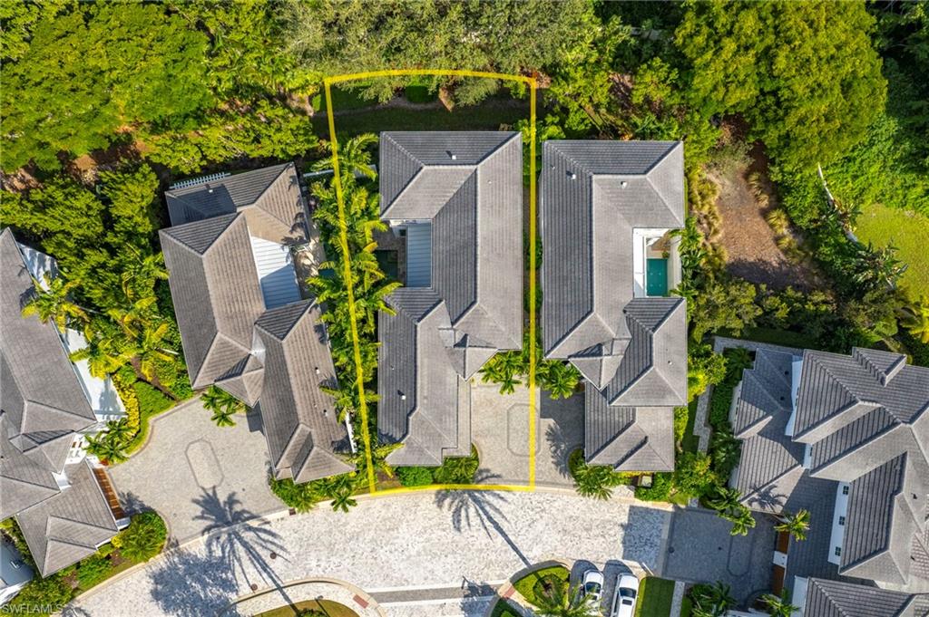 9149 Mercato Way Naples, FL 34108 - Photo 43 of 47 an aerial view of a house with a yard and large trees