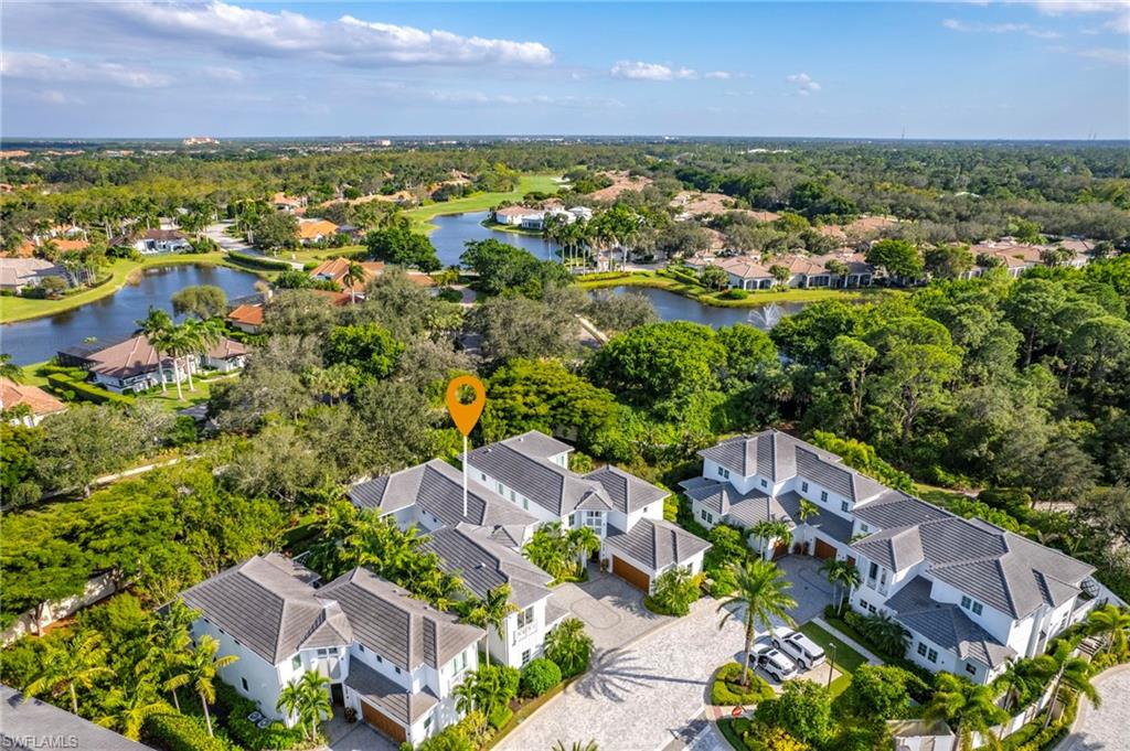 9149 Mercato Way Naples, FL 34108 - Photo 46 of 47 an aerial view of residential houses with outdoor space and trees