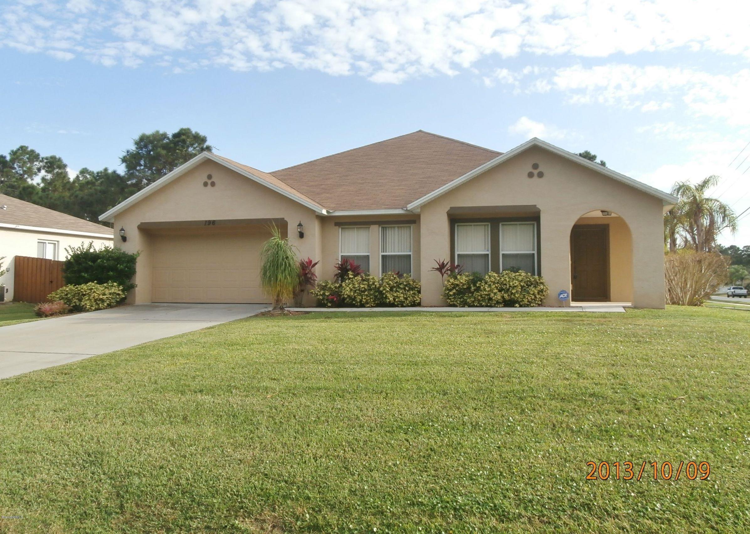 196 Scotch Street Southwest Palm Bay, FL 32908 - Photo 1 of 24 Front
