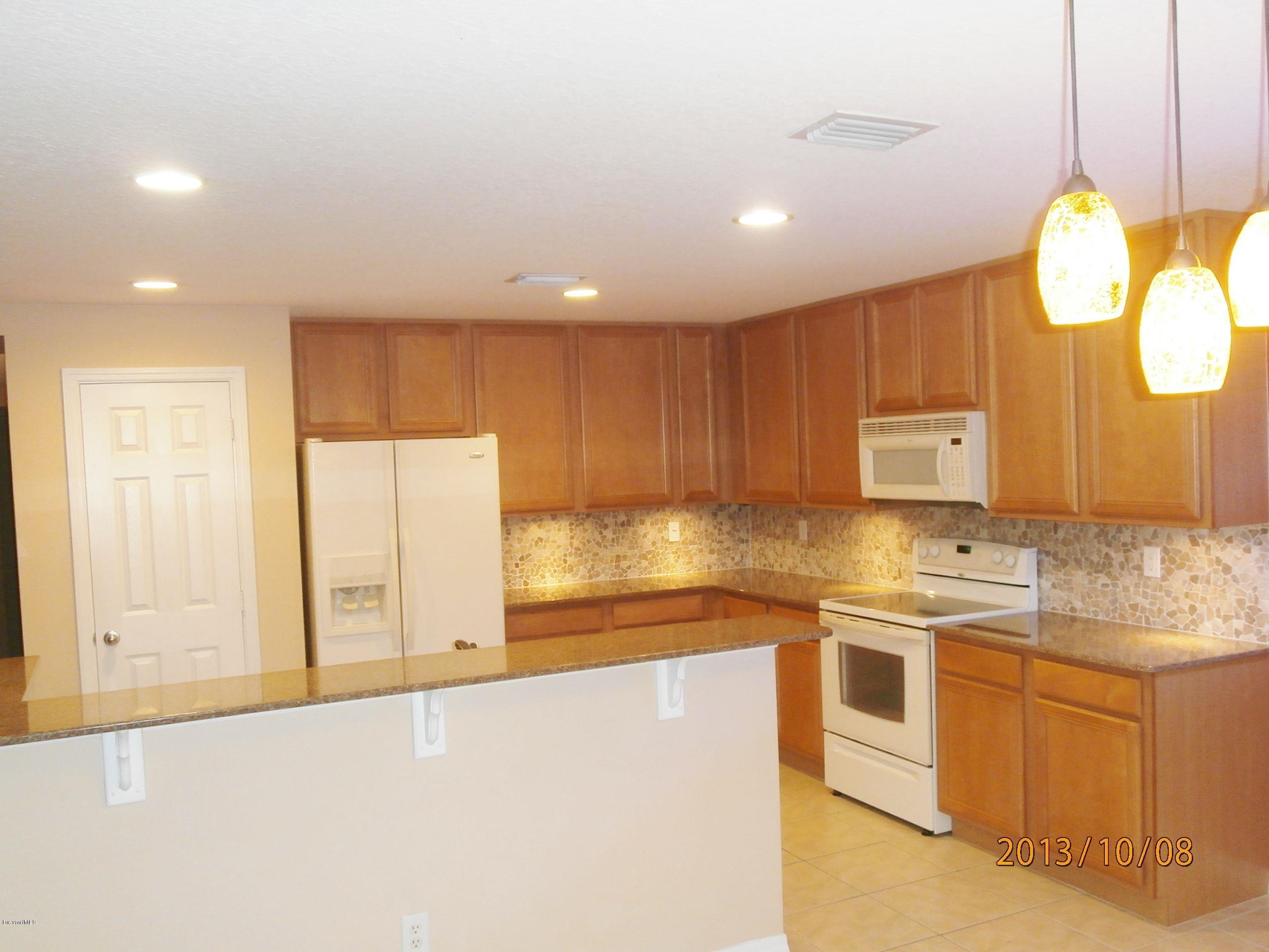 196 Scotch Street Southwest Palm Bay, FL 32908 - Photo 4 of 24 Scotch kitchen from nook