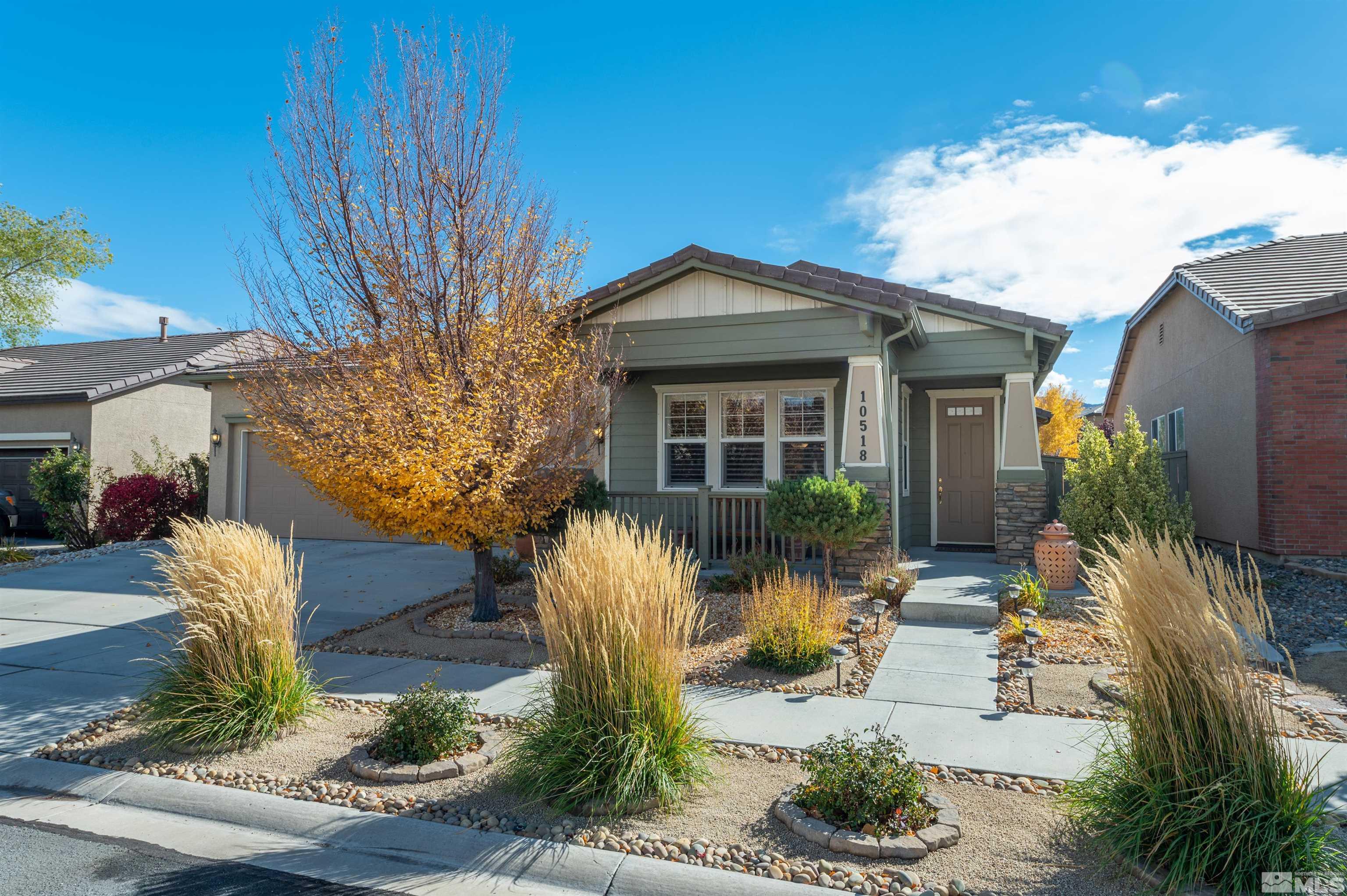 10518 Crystal Bay Drive Reno, NV 89521 - Photo 1 of 39 a front view of a house with garden