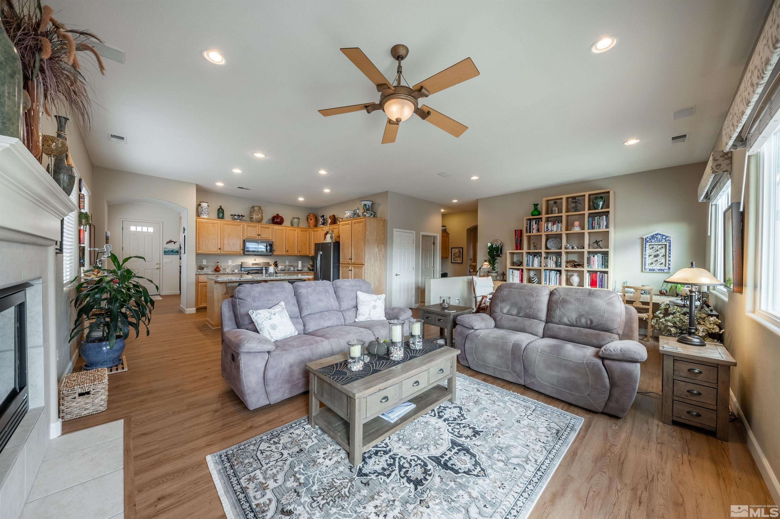10518 Crystal Bay Drive Reno, NV 89521 - Photo 2 of 39 a living room with furniture or couch and a wooden floor
