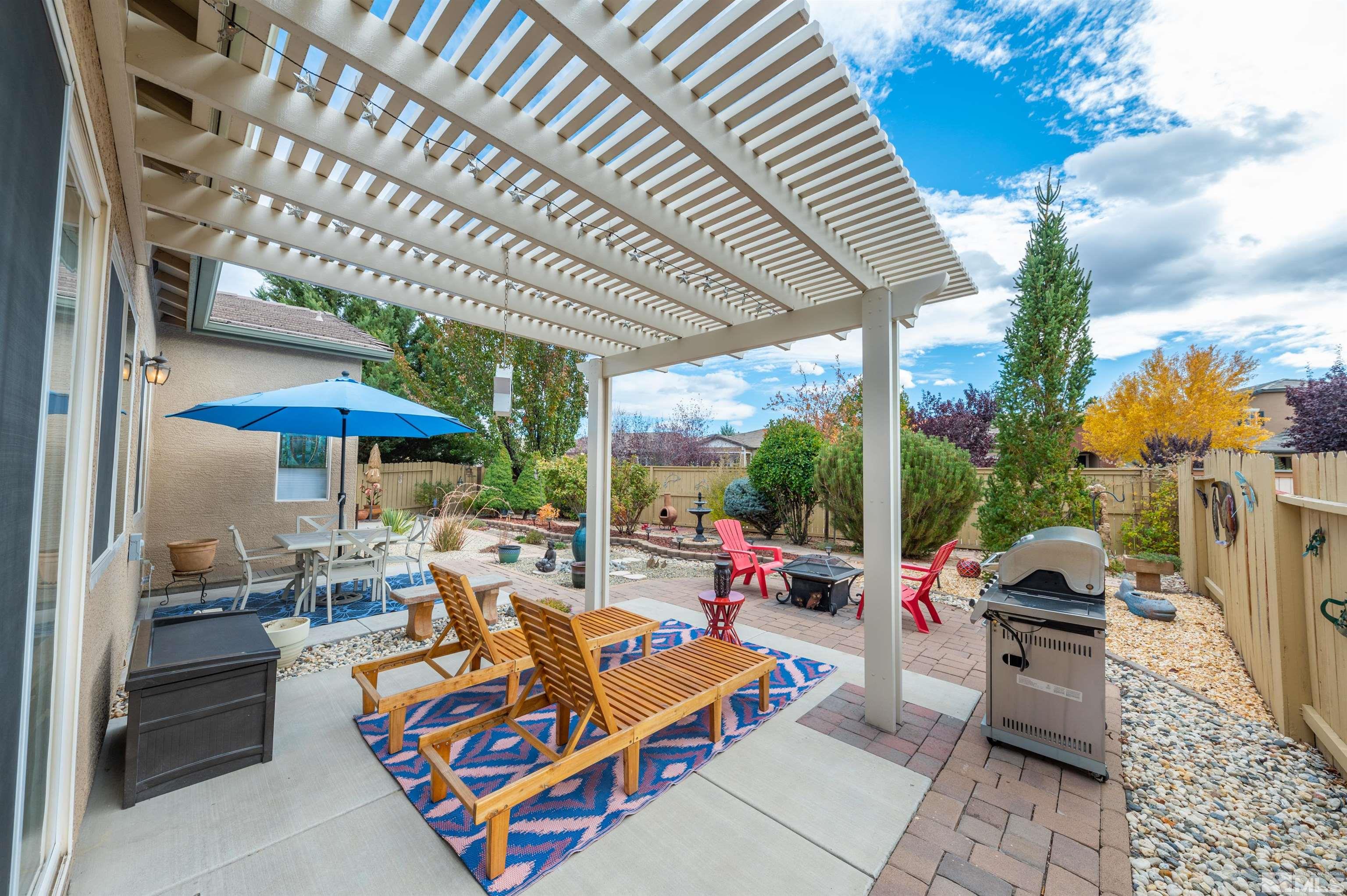 10518 Crystal Bay Drive Reno, NV 89521 - Photo 28 of 39 a outdoor space with patio lots of furniture and umbrella