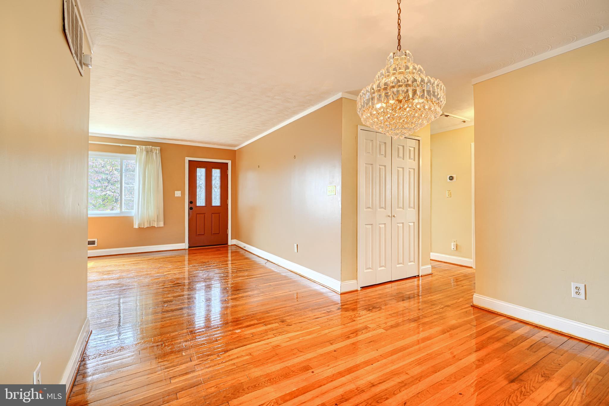 930 Sedgley Road Baltimore, MD 21228 - Photo 13 of 43 a view of livingroom with hardwood floor and hallway