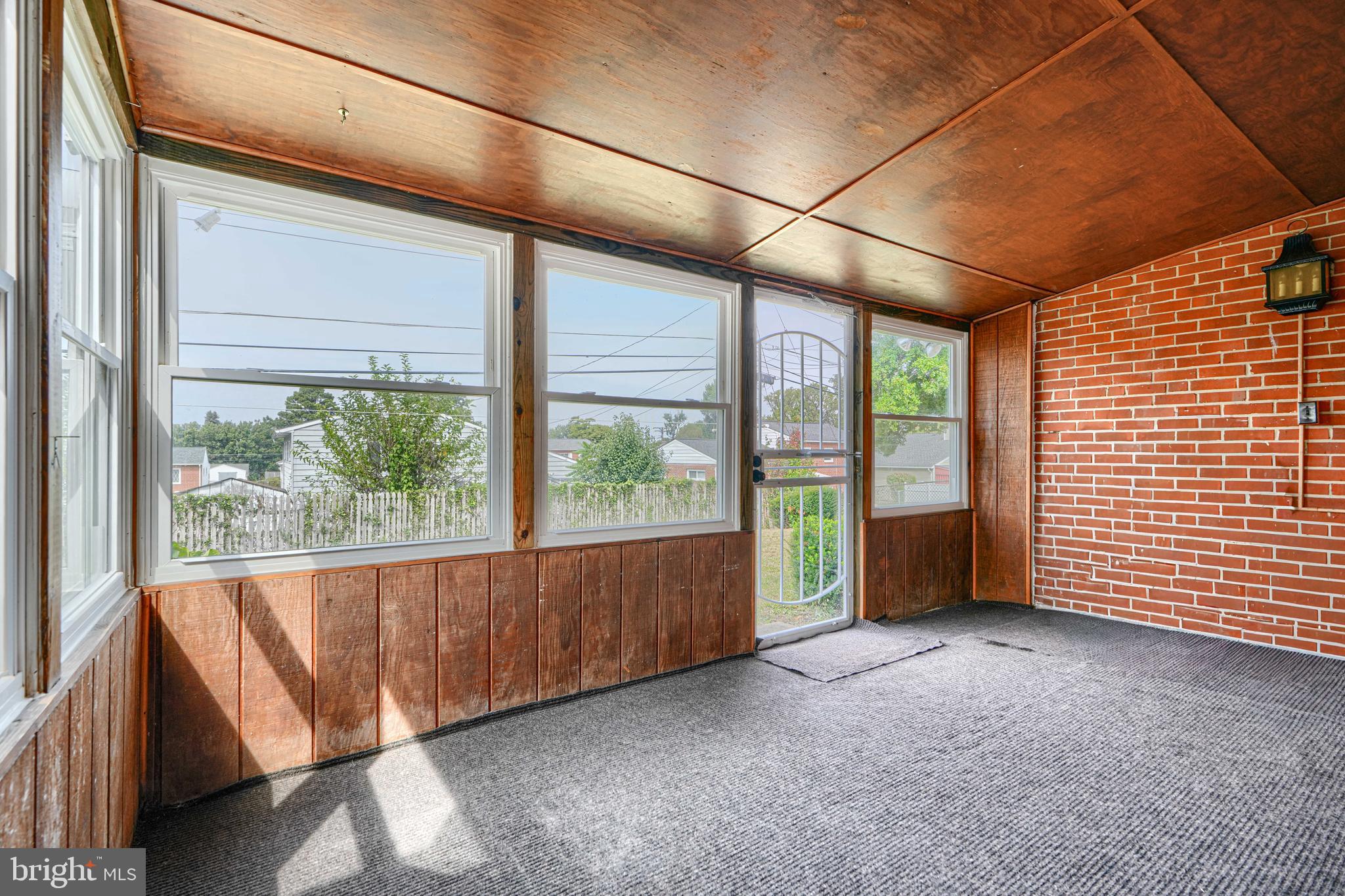 930 Sedgley Road Baltimore, MD 21228 - Photo 19 of 43 a view of an empty room with a balcony