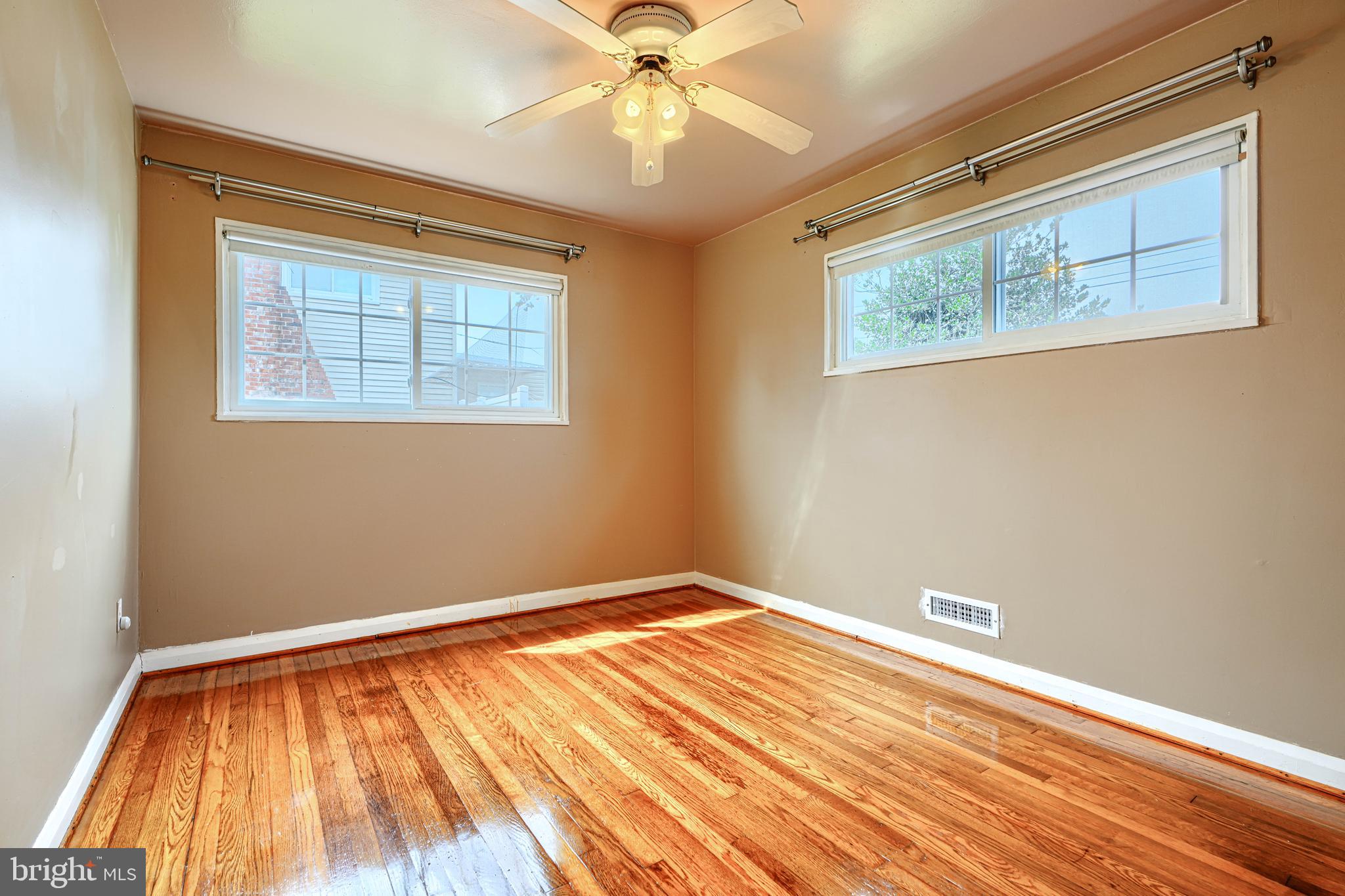 930 Sedgley Road Baltimore, MD 21228 - Photo 22 of 43 a view of a room with wooden floor and fan