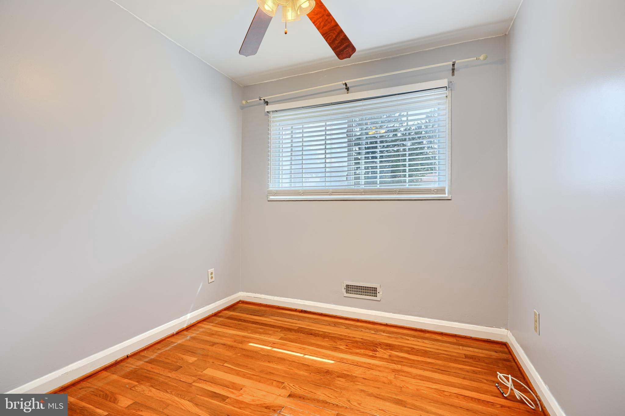 930 Sedgley Road Baltimore, MD 21228 - Photo 26 of 43 a view of empty room with wooden floor