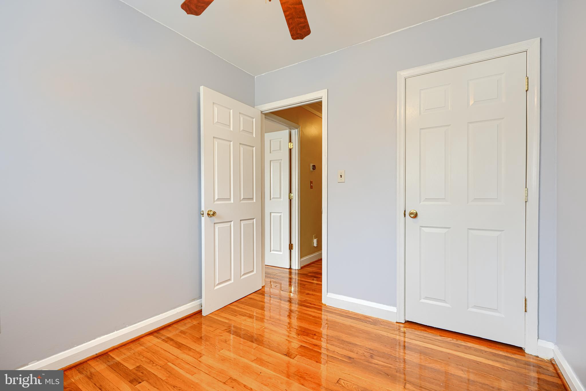 930 Sedgley Road Baltimore, MD 21228 - Photo 27 of 43 an empty room with wooden floor and closet