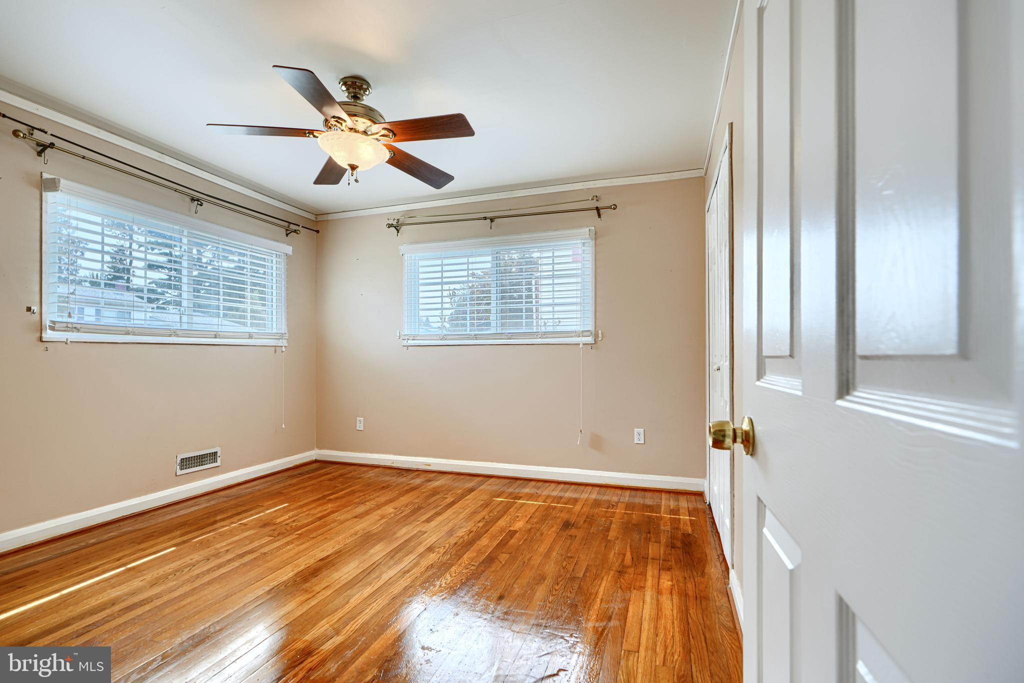 930 Sedgley Road Baltimore, MD 21228 - Photo 30 of 43 a view of an empty room with wooden floor and a window