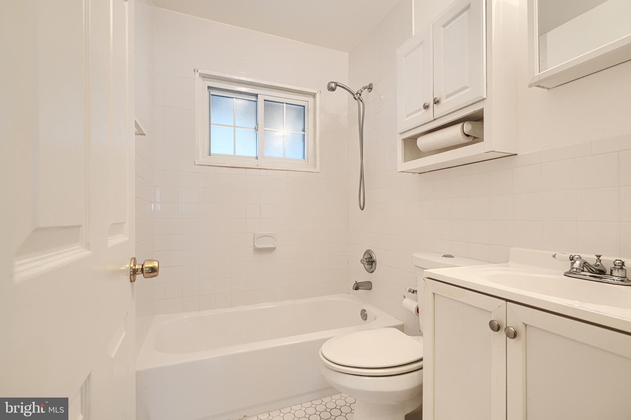 930 Sedgley Road Baltimore, MD 21228 - Photo 33 of 43 a bathroom with a sink toilet and shower