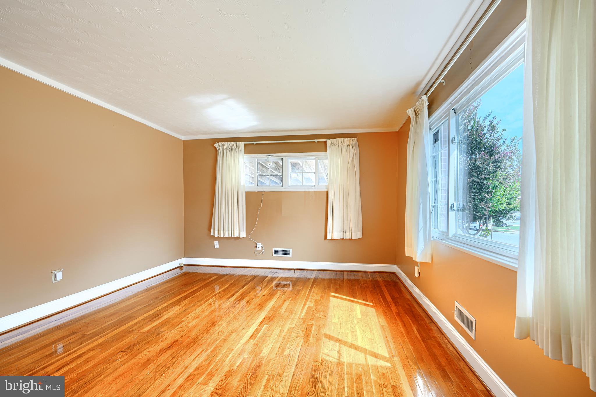 930 Sedgley Road Baltimore, MD 21228 - Photo 6 of 43 a view of a room with wooden floor and a window