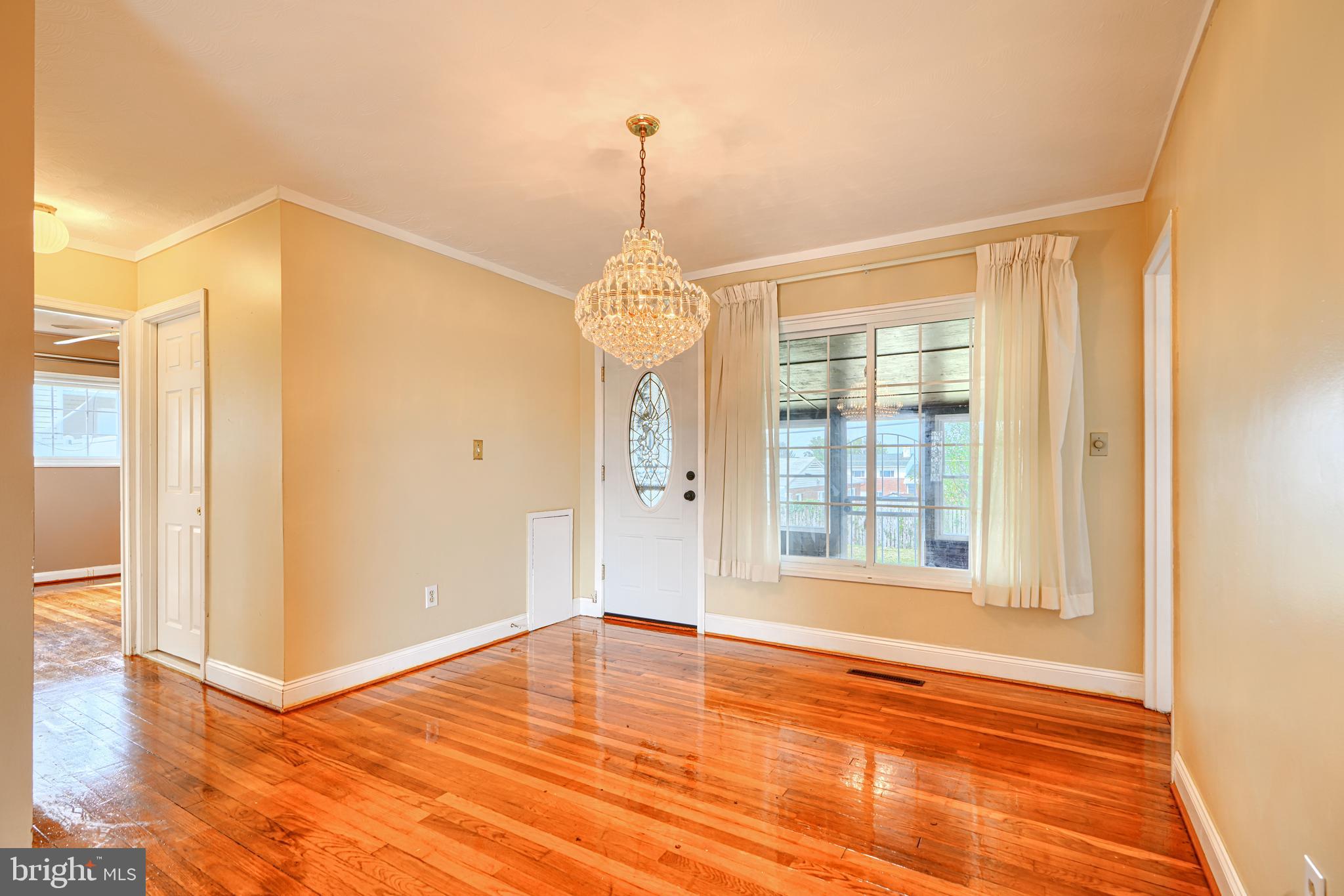 930 Sedgley Road Baltimore, MD 21228 - Photo 10 of 43 a view of a room with wooden floor and a window