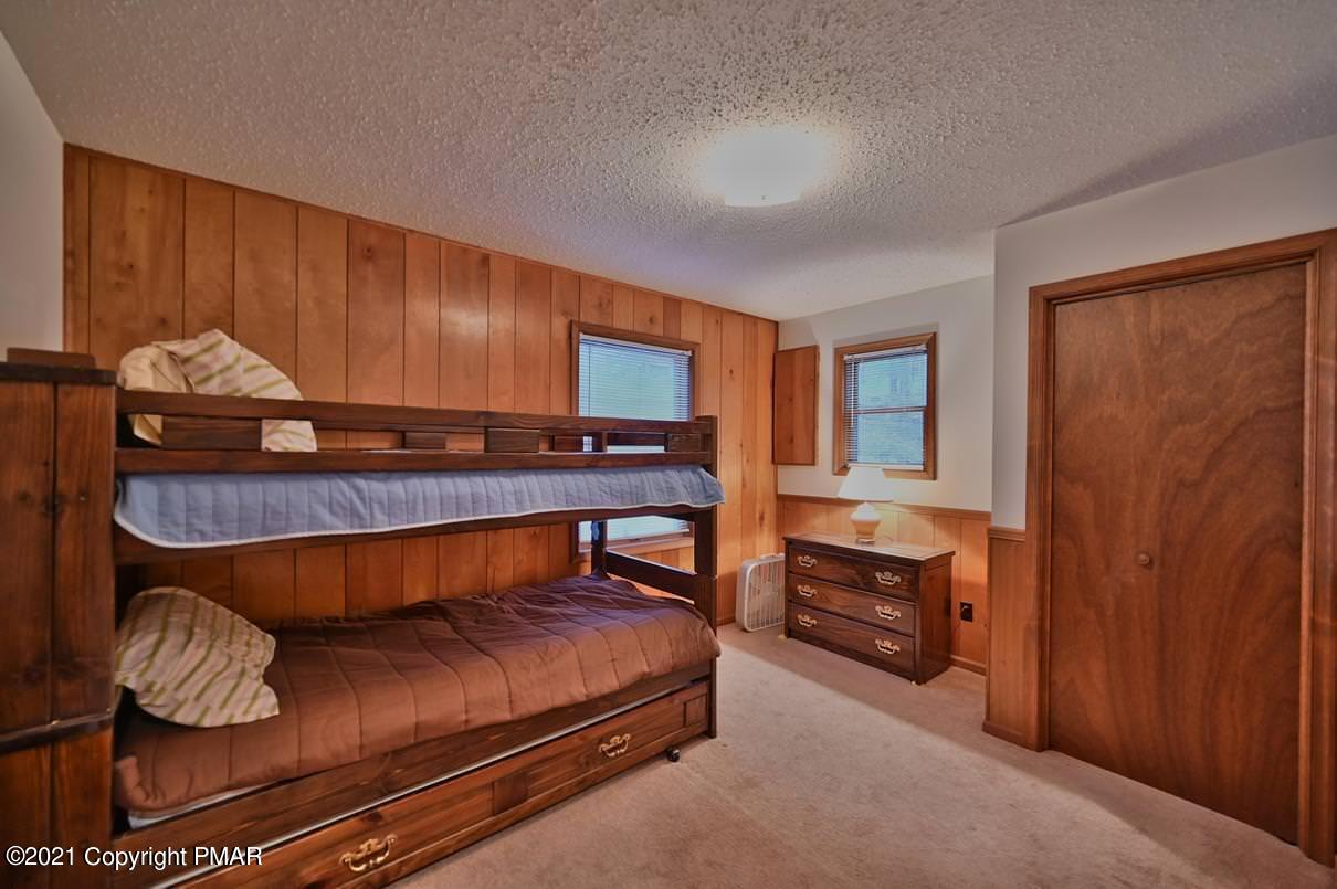 170 Radcliff Road Bushkill, PA 18324 - Photo 17 of 27 a bedroom with furniture and a window