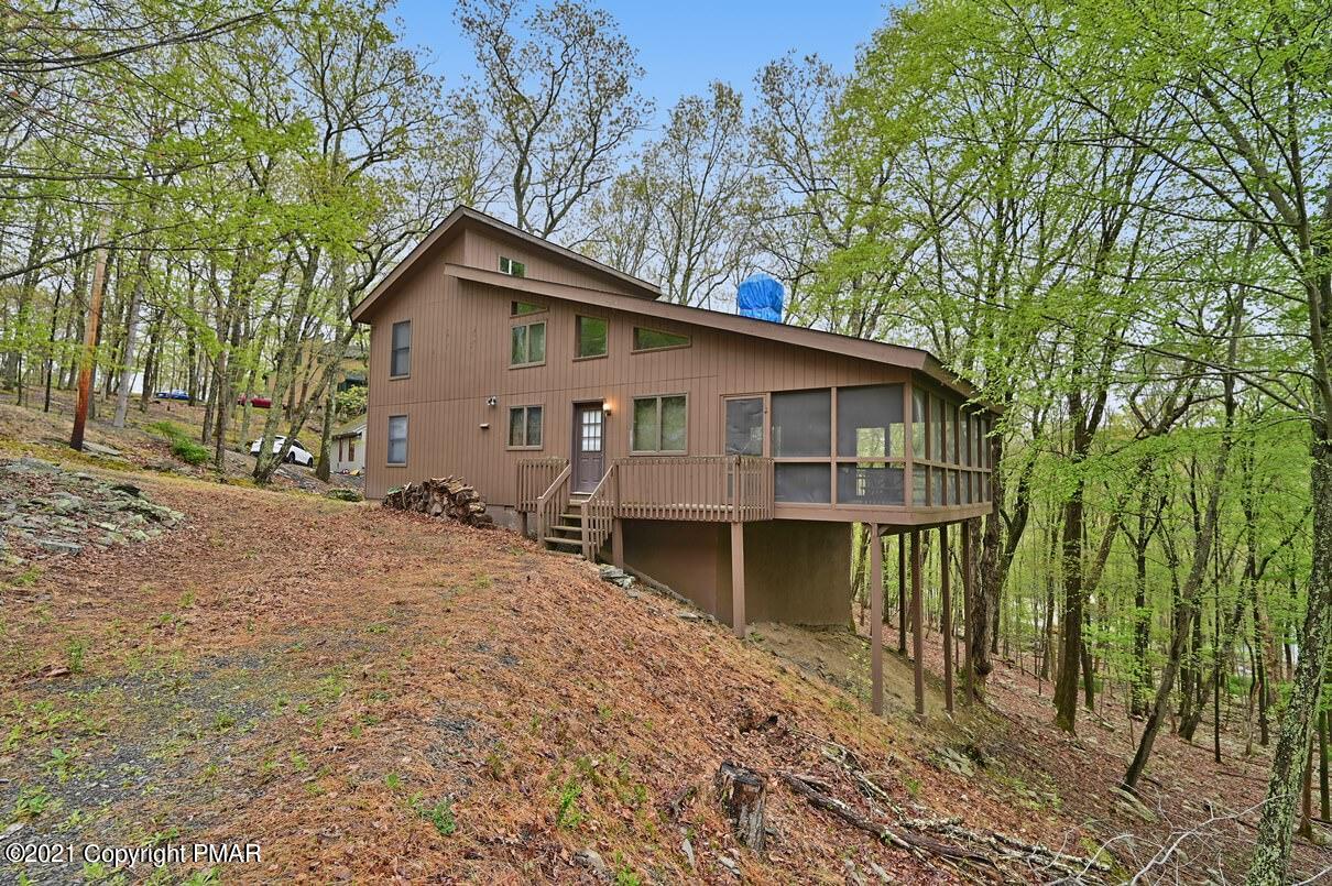 170 Radcliff Road Bushkill, PA 18324 - Photo 3 of 27 a view of a house with a yard and large tree
