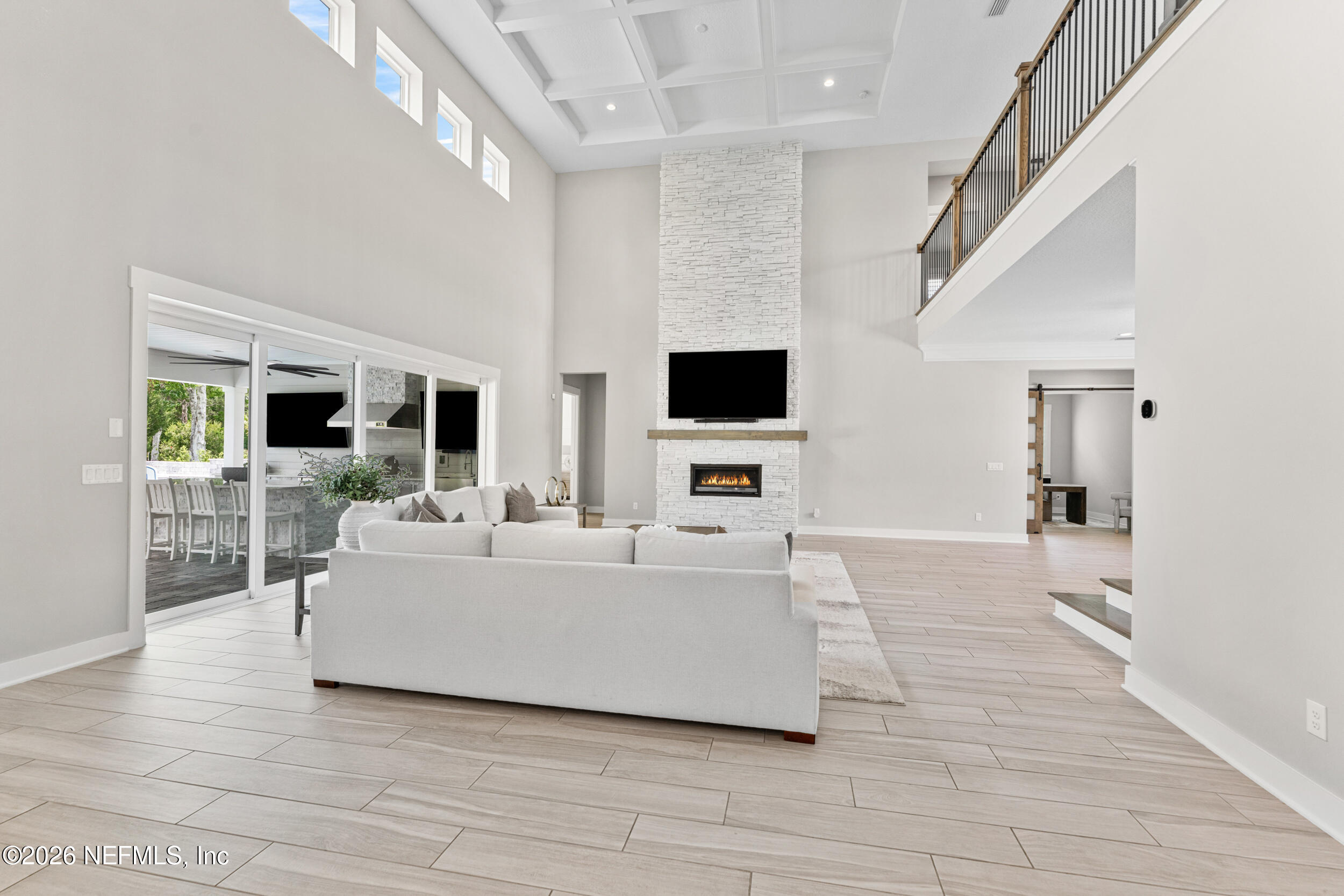 245 Ranch Land Circle St. Johns, FL 32259 - Photo 15 of 74 a living room with furniture and a flat screen tv