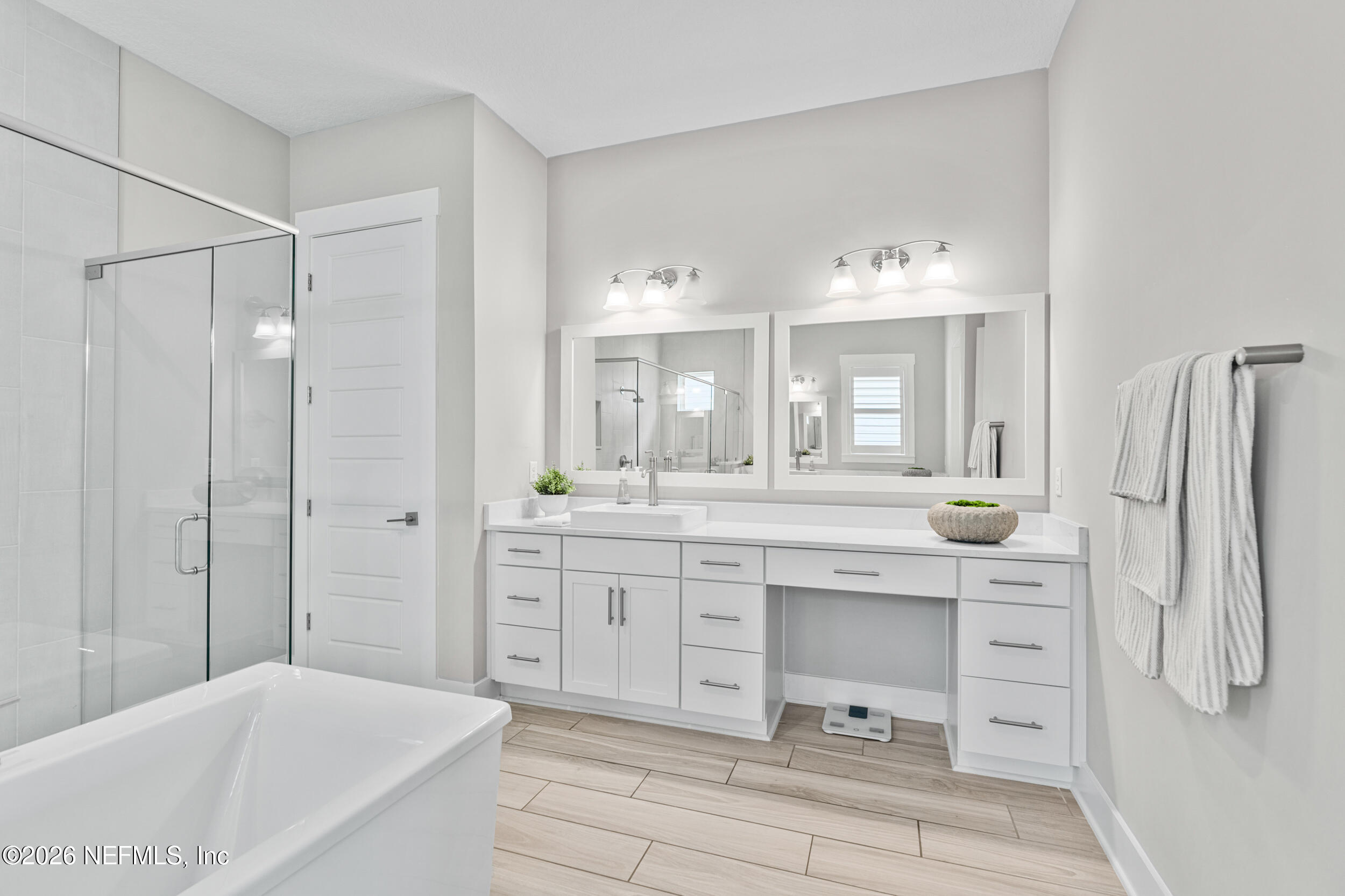 245 Ranch Land Circle St. Johns, FL 32259 - Photo 26 of 74 a spacious bathroom with a granite countertop sink mirror and a bathtub