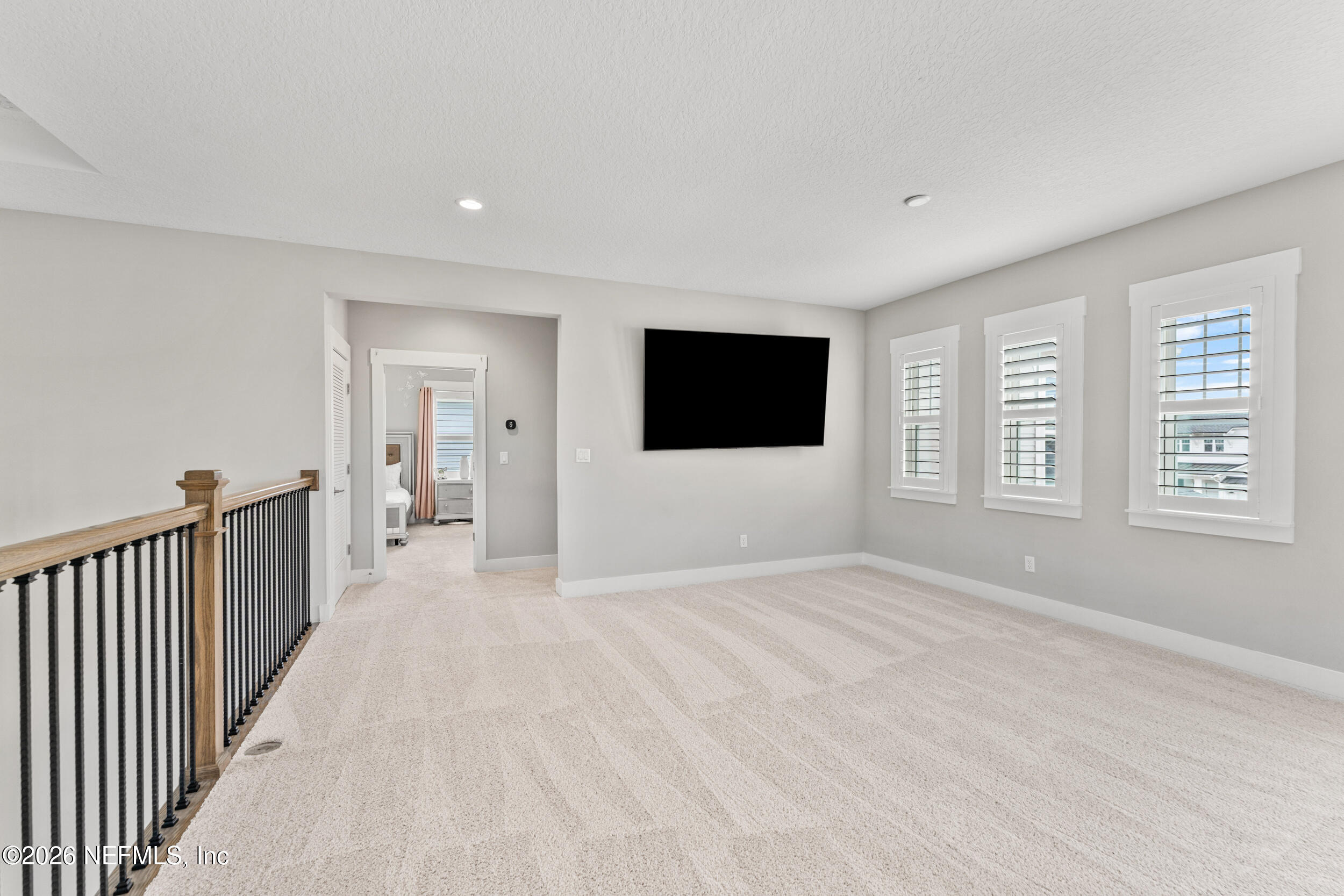 245 Ranch Land Circle St. Johns, FL 32259 - Photo 30 of 74 a view of a livingroom with a flat screen tv