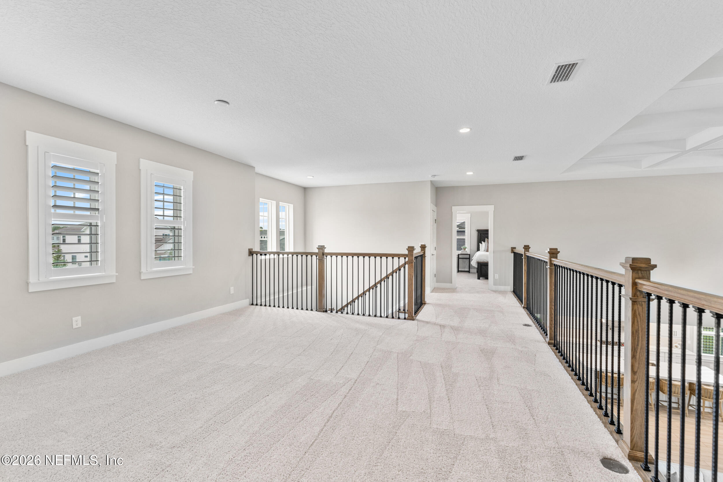245 Ranch Land Circle St. Johns, FL 32259 - Photo 31 of 74 a view of a bedroom with wooden floor and windows