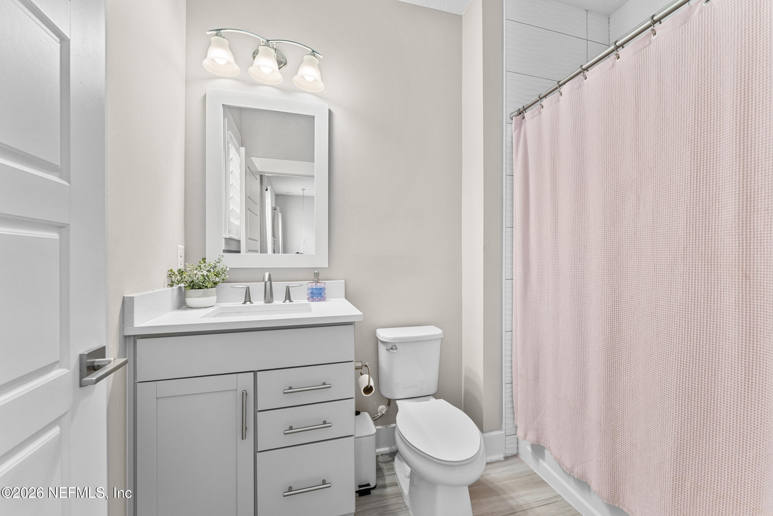 245 Ranch Land Circle St. Johns, FL 32259 - Photo 37 of 74 a bathroom with a toilet sink and mirror