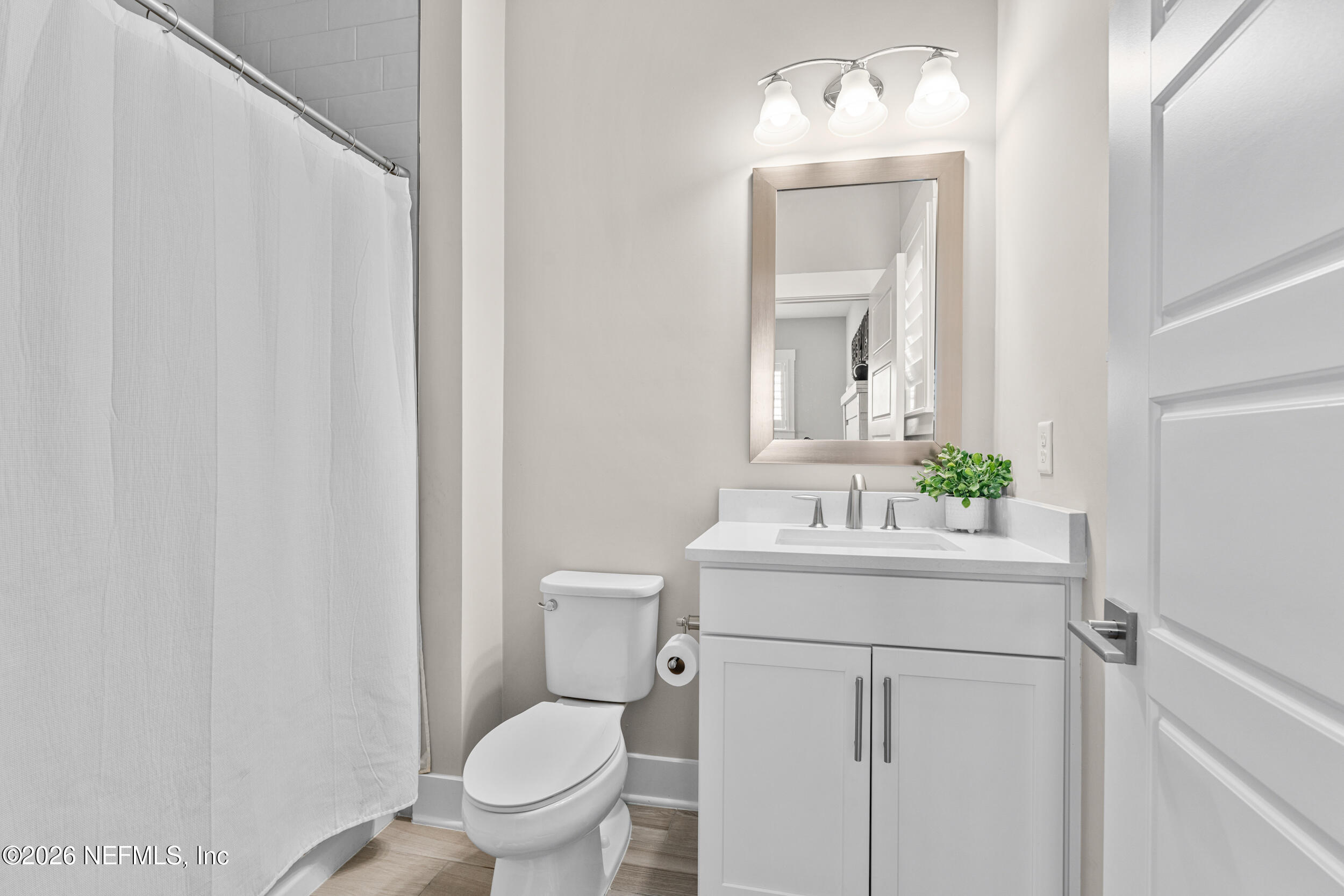 245 Ranch Land Circle St. Johns, FL 32259 - Photo 40 of 74 a bathroom with a toilet a sink and a mirror