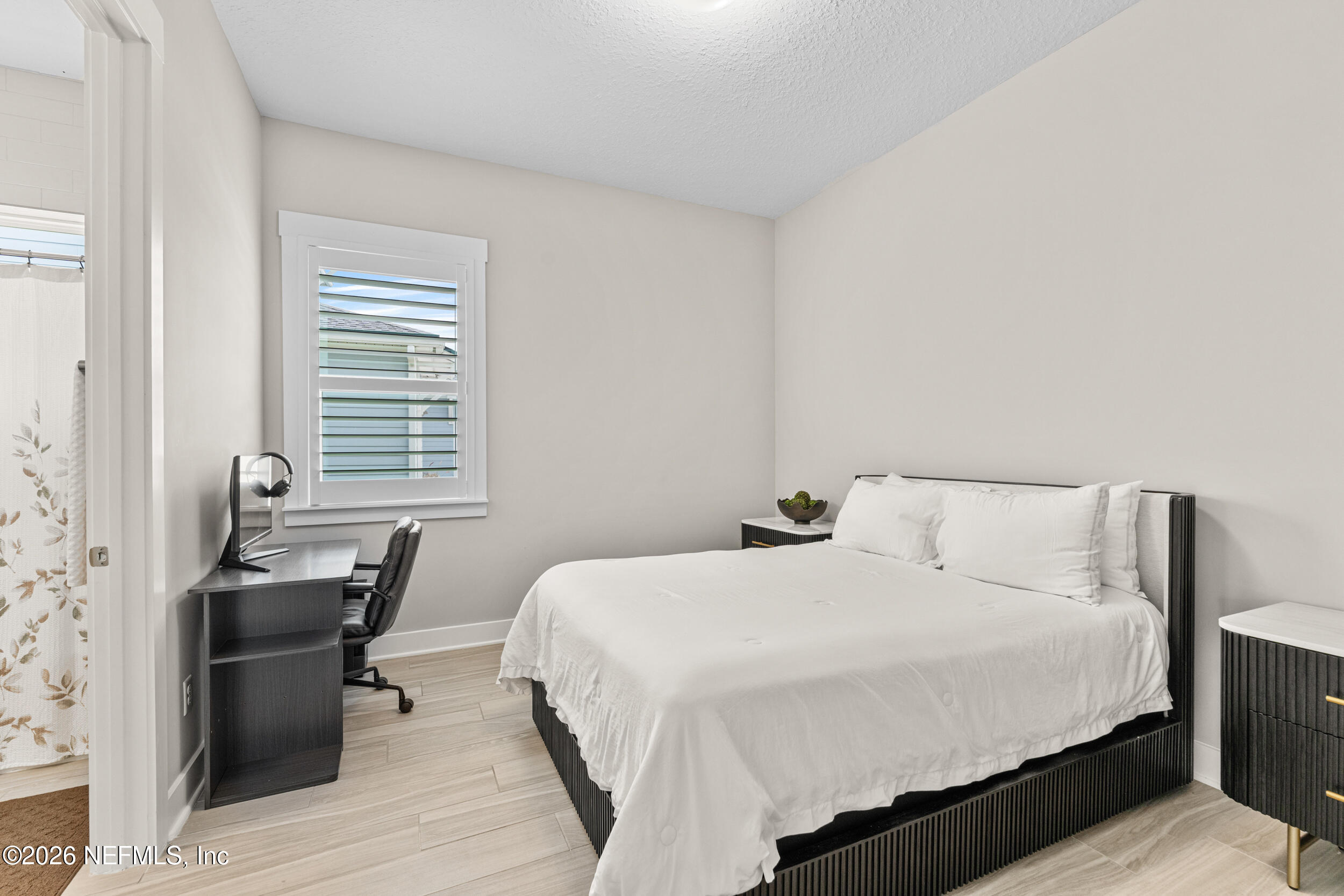 245 Ranch Land Circle St. Johns, FL 32259 - Photo 41 of 74 a bedroom with a bed and wooden floor
