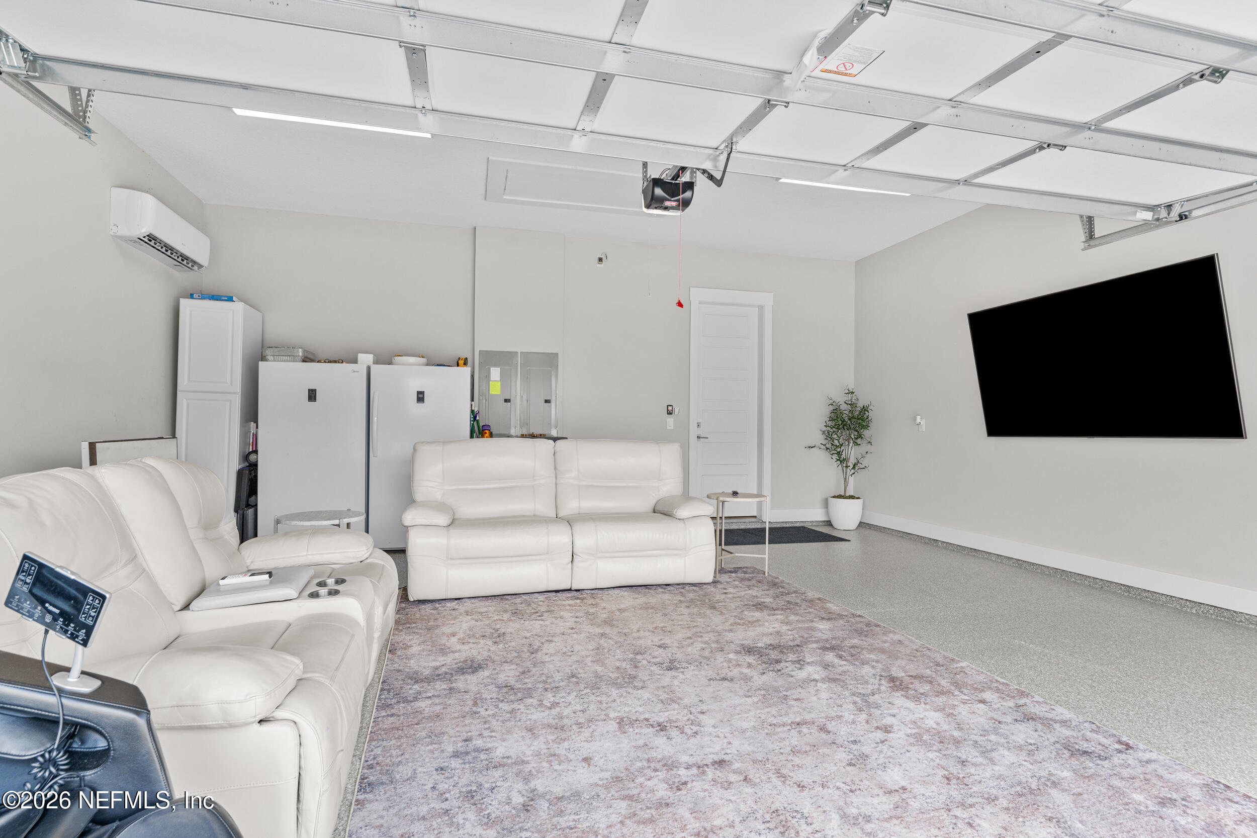 245 Ranch Land Circle St. Johns, FL 32259 - Photo 47 of 74 a view of a livingroom with furniture and a flat screen tv
