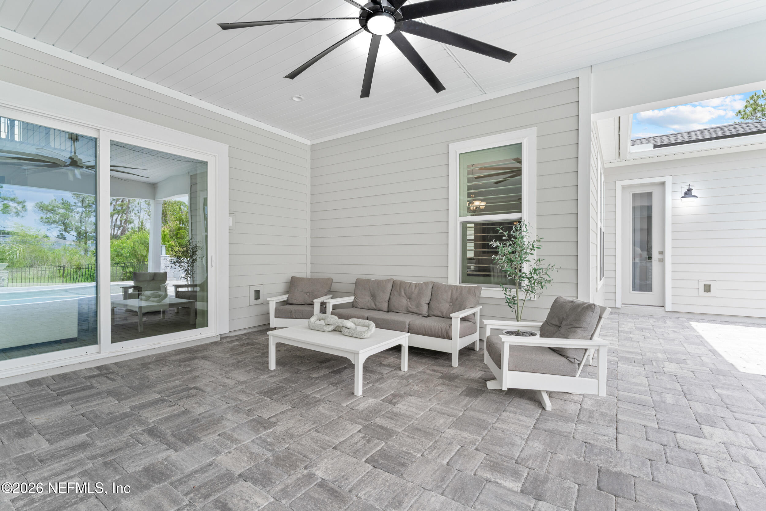 245 Ranch Land Circle St. Johns, FL 32259 - Photo 49 of 74 a living room with furniture and a large window