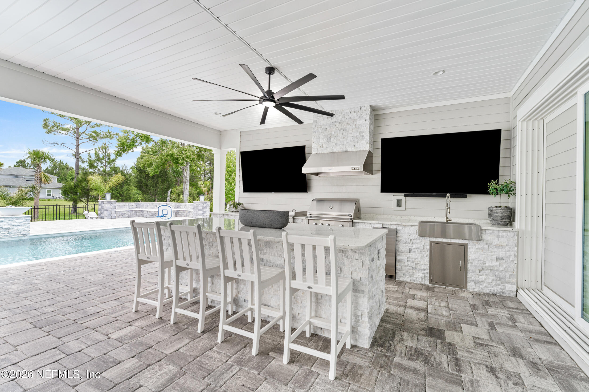245 Ranch Land Circle St. Johns, FL 32259 - Photo 50 of 74 a view of a dining room with furniture wooden floor and flat screen tv
