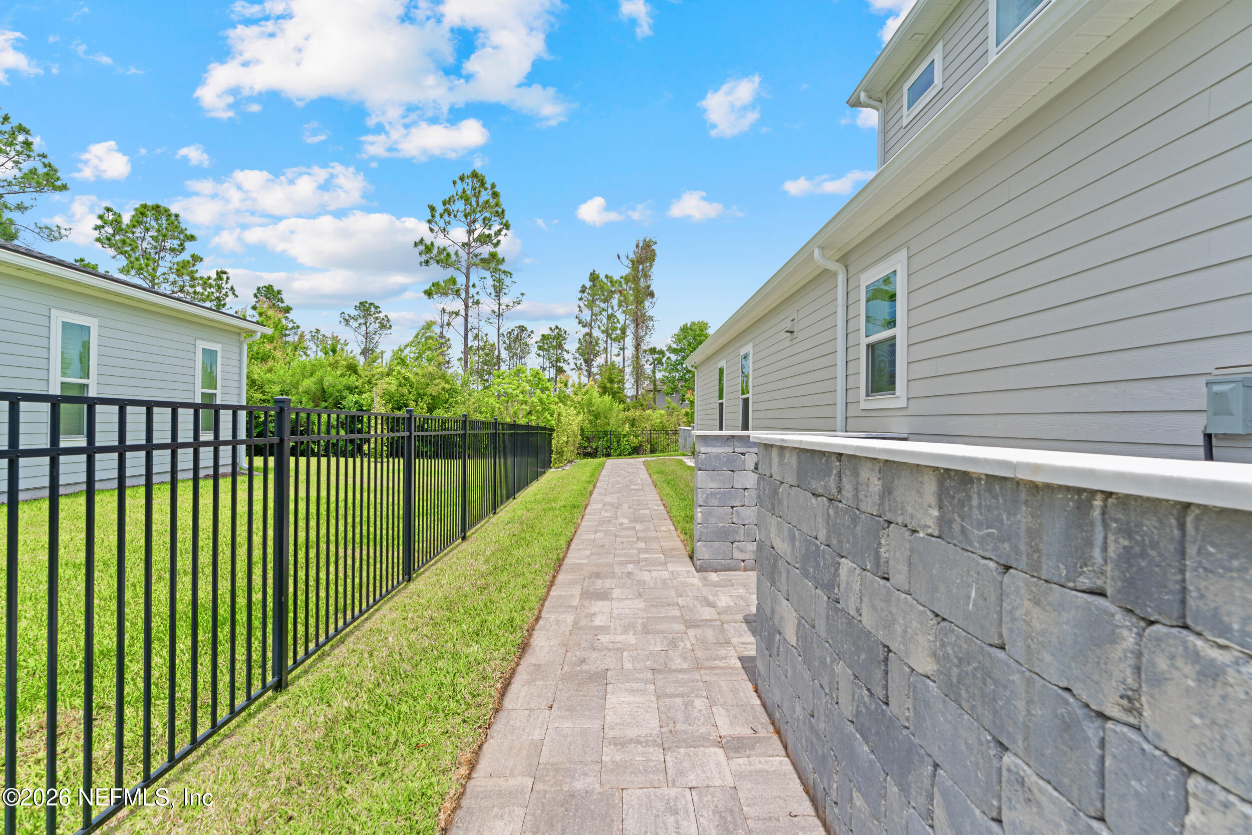 245 Ranch Land Circle St. Johns, FL 32259 - Photo 63 of 74 a view of a backyard with a garden