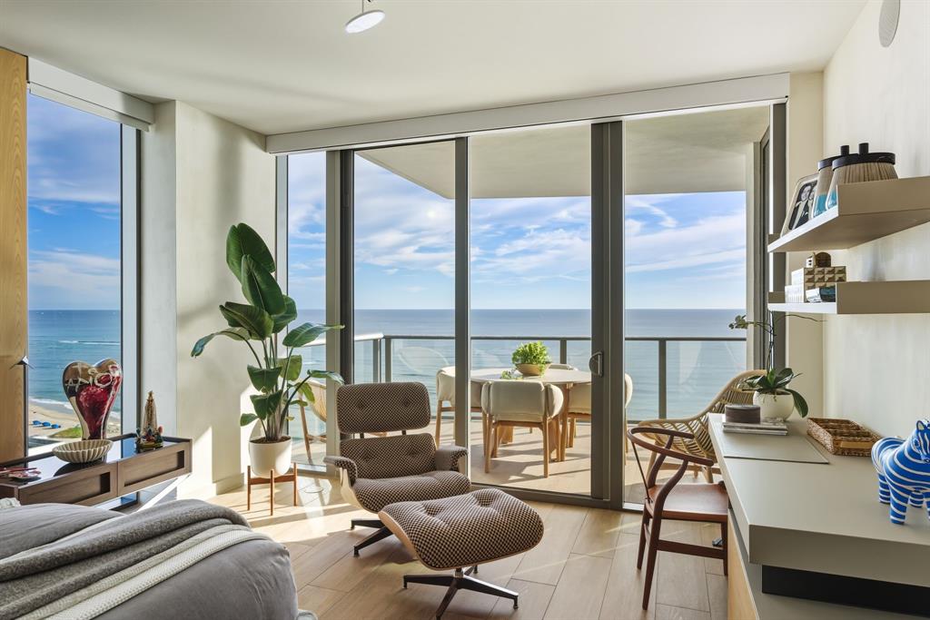 1116 North Ocean Boulevard, Unit 1506 Pompano Beach, FL 33062 - Photo 15 of 69 a living room with furniture and a floor to ceiling window