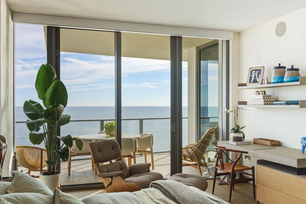 1116 North Ocean Boulevard, Unit 1506 Pompano Beach, FL 33062 - Photo 17 of 69 a living room with furniture and a window